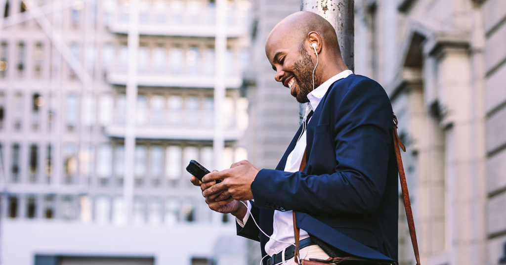 Man looking at phone in the City