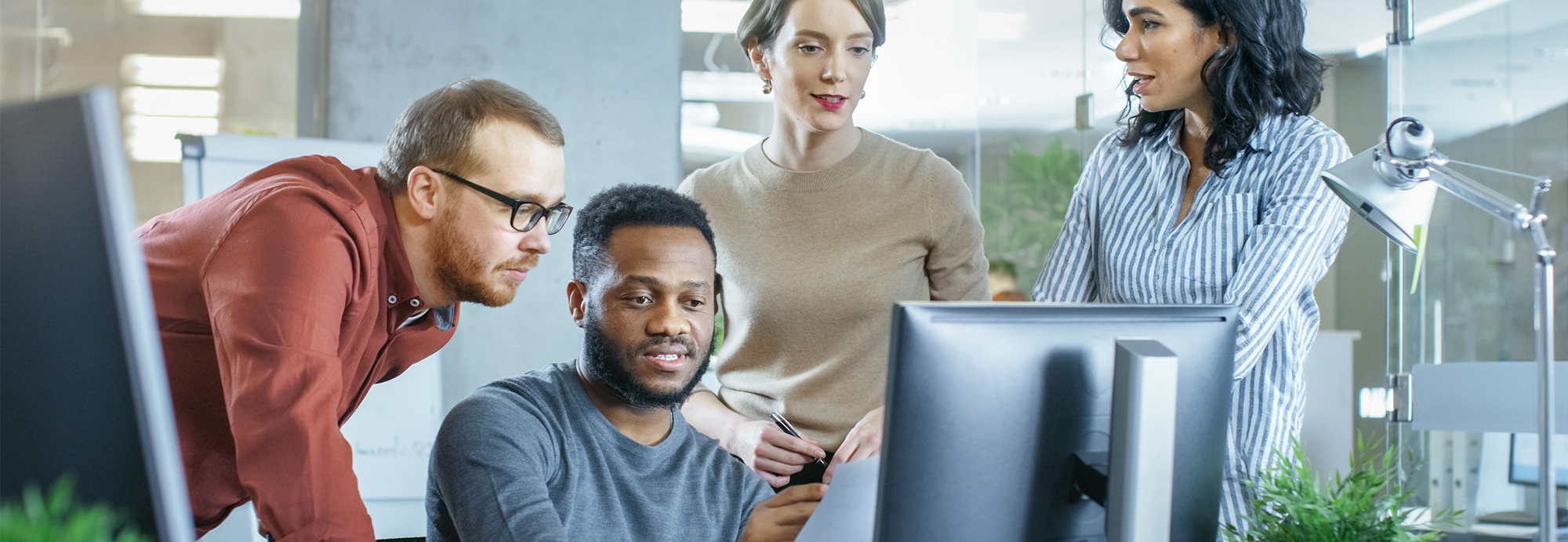 people looking at the monitor